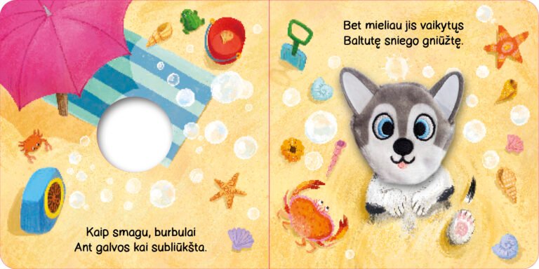 Šuniukas. Su žaisliuku ant piršto
